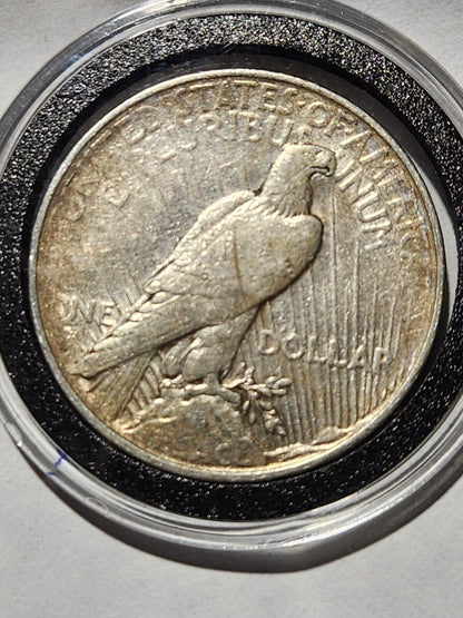 USA  $1 Silver PEACE 90% 1923D with plastic holder.19W3M1